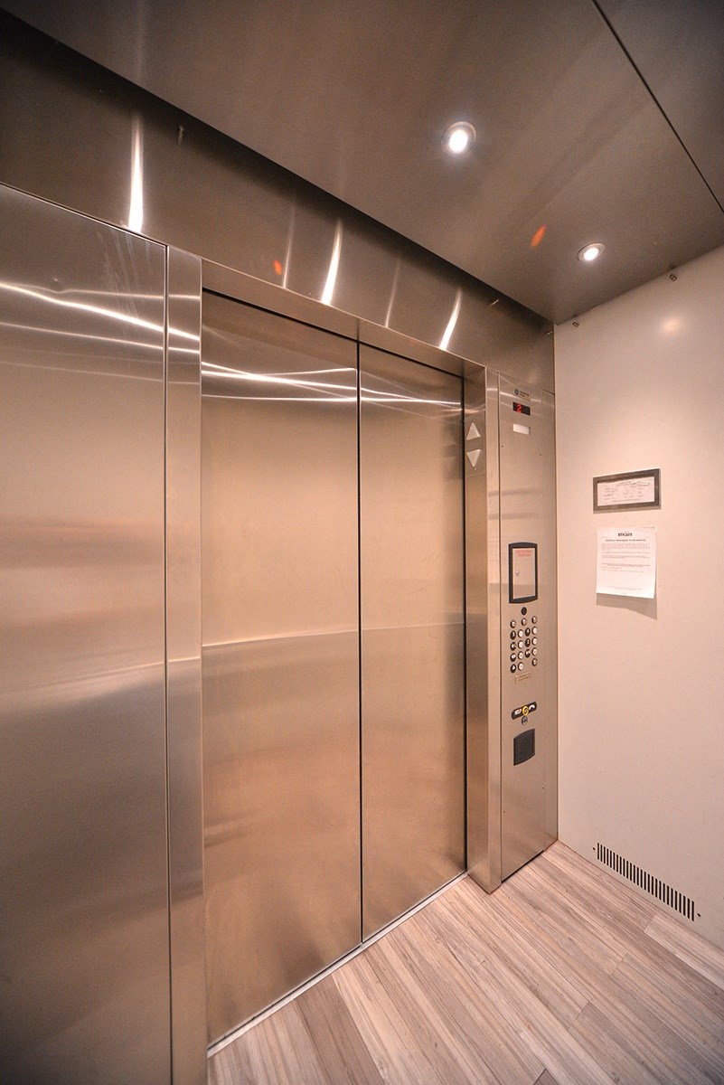 Elevator access to upper level apartments at 12th Street Lofts in National City, California.