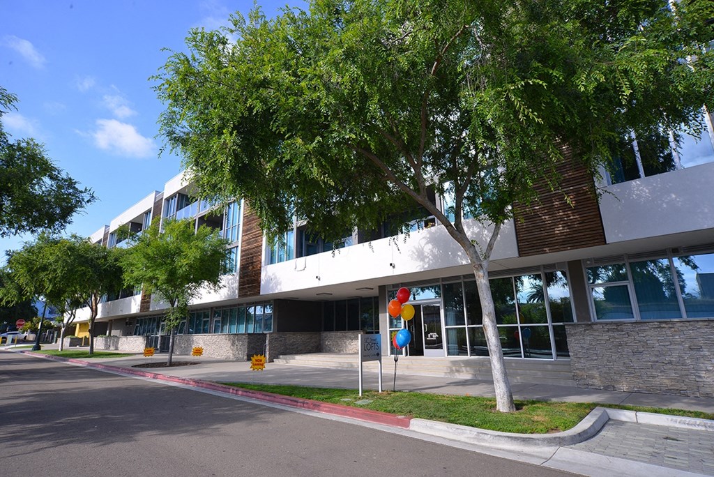 Nice tree-lined sidewalk in front of 12th Street Lofts in National City, California.