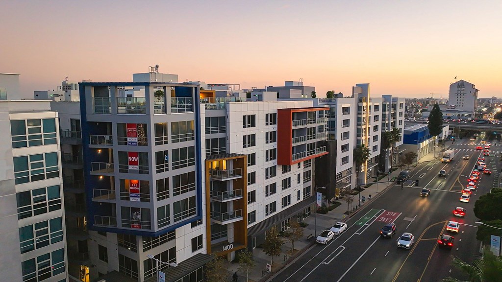 an aerial view of a city street with tall buildings