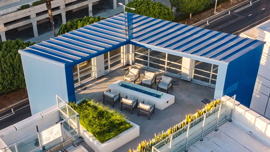 a rendering of a rooftop patio with a pool and a blue roof