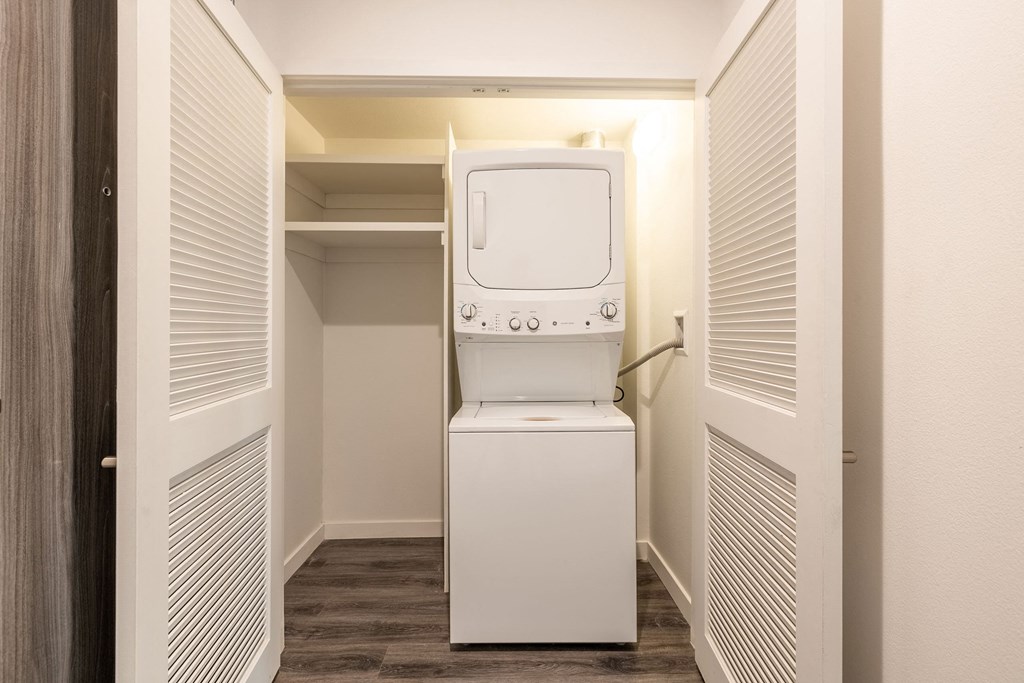 a washer and dryer in a closet in a room with a washing machine