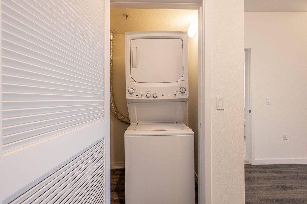 a laundry room with a washer and dryer in a closet