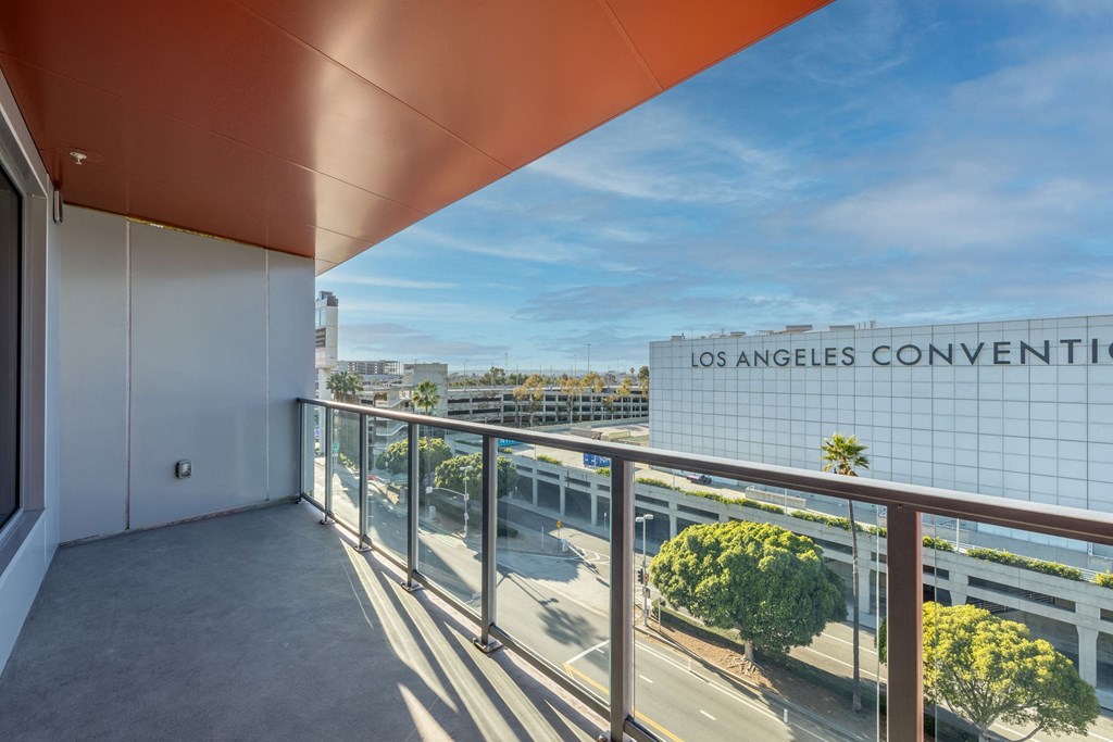 a balcony with a view of the city