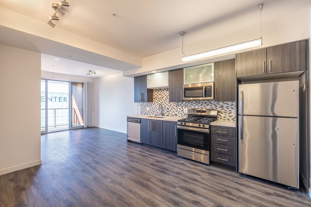 a view of a kitchen with a geometric design on the wall