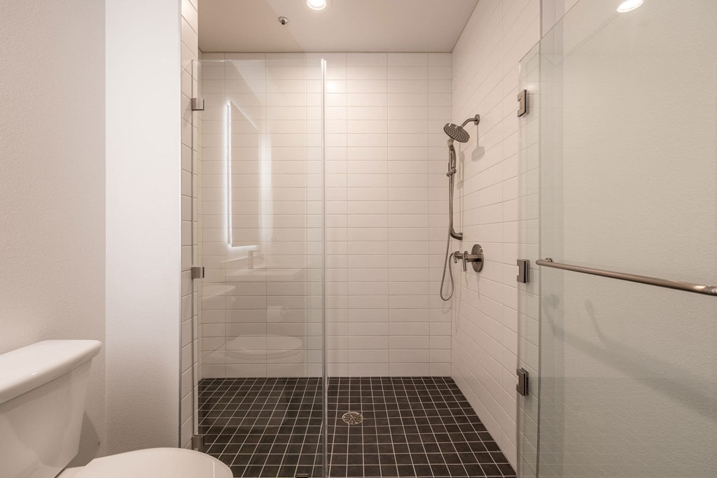 Bathroom with walk-in shower in a 1400 FIG Live and Work Apartment at 1400 S. Figueroa St., Los Angeles, CA 90015.