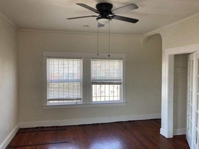 Studio apartment with great windows, ceiling fan, and old-style charm at The Western at Rosewood Apartments in Los Angeles, California.