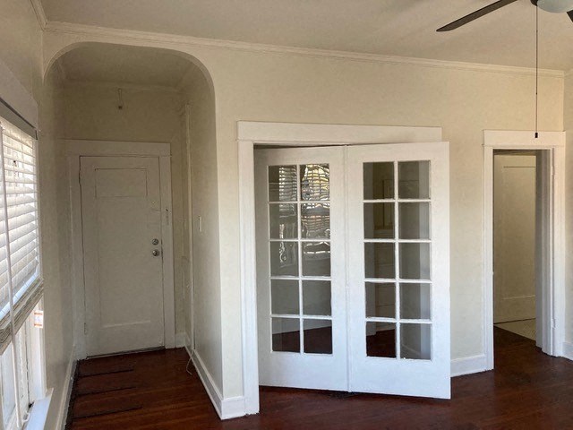 Studio apartment with hardwood floors, ceiling fan and old-style charm at The Western at Rosewood Apartments in Los Angeles, California.