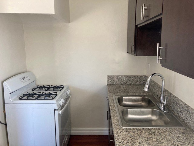 a kitchen with a stove and a sink
