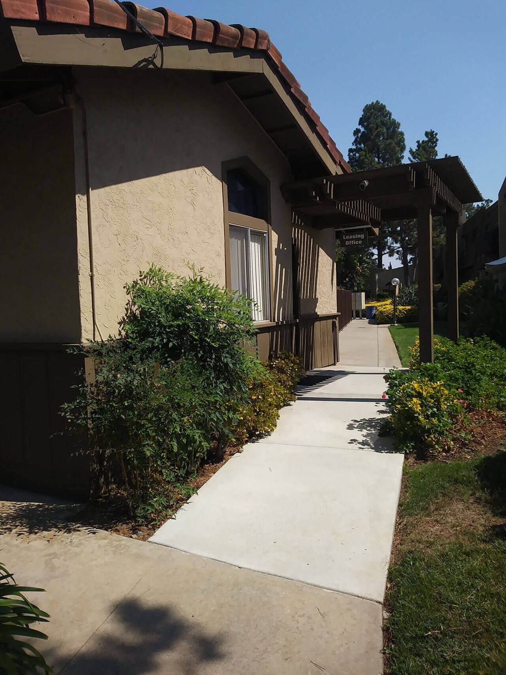 Walkway to leasing office at Teton Pines Apartments in Escondido, California.