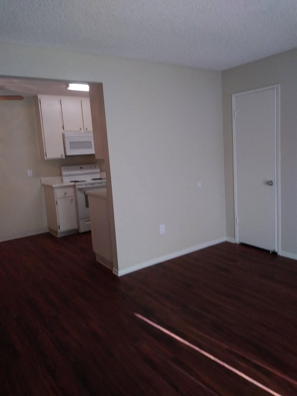 Front entry into living room at Teton Piines Apartments in Escondido, California.