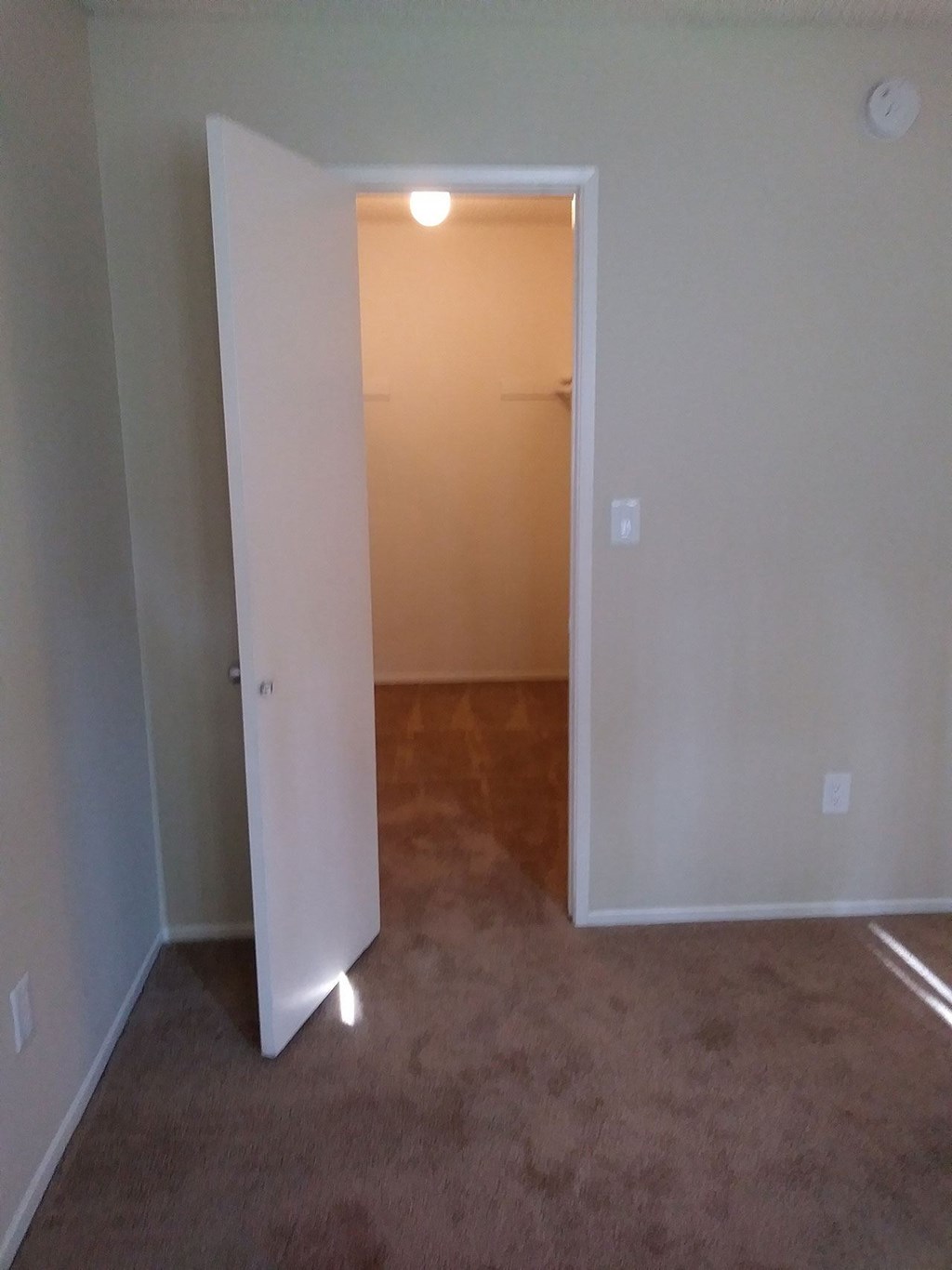 Betroom with large walk-in closet at Teton Pines Apartments in Esoncdido, California.