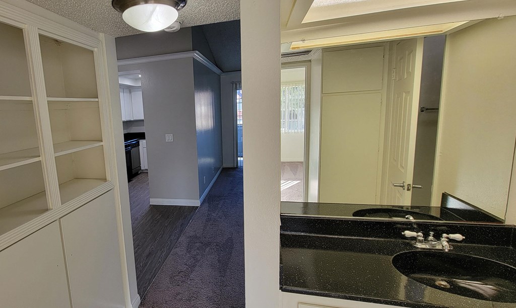 Open vanity off bedroom hallway at Northwood Apartments in Upland, California.