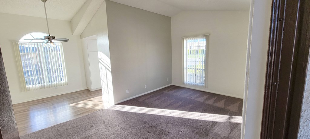 Enterance view of living room, dining room and adjacent kitchen at Northwood Apartments in Upland, California.