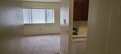 a view of a kitchen from the living room