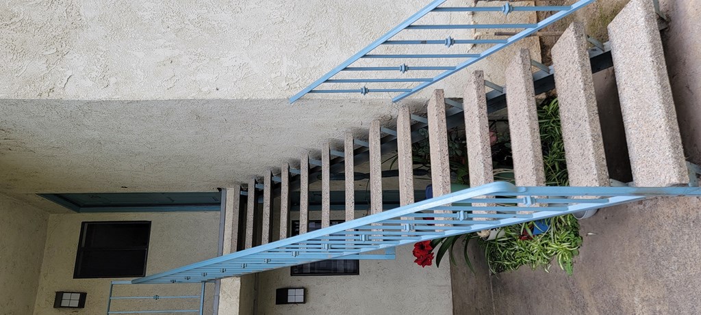 Stairway to second floor apartment at Magnolia Apartments in Riverside, California.