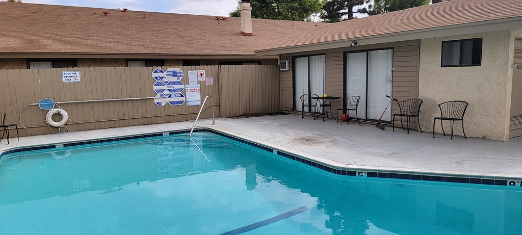 Gated swimming pool at Las Casitas Apartments in Riverside, California.