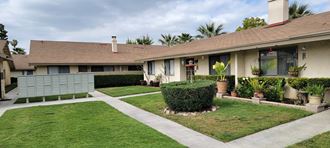 Nice landscaping and mailboxes at Las Casitas Apartments in Riverside, California.