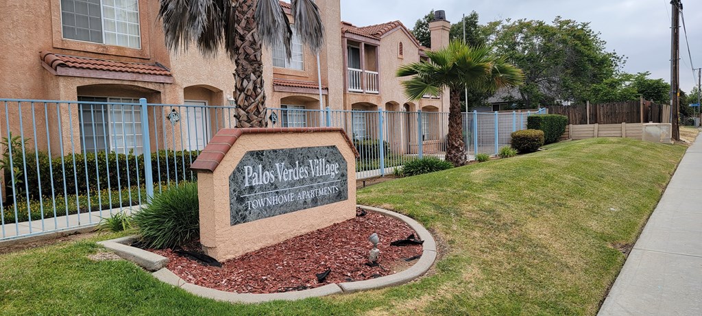 View from Dracaea Avenue of front enterance area of Palos Verdes Village Townhomes.