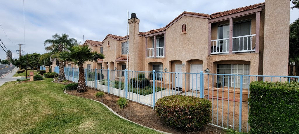 Sidewalk view of Palos Verdes Village on Dracaea Avenue in Moreno Valley, CA..