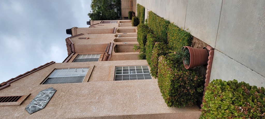 Sidewalk between buildings at Palos Verdes Village Townhomes.