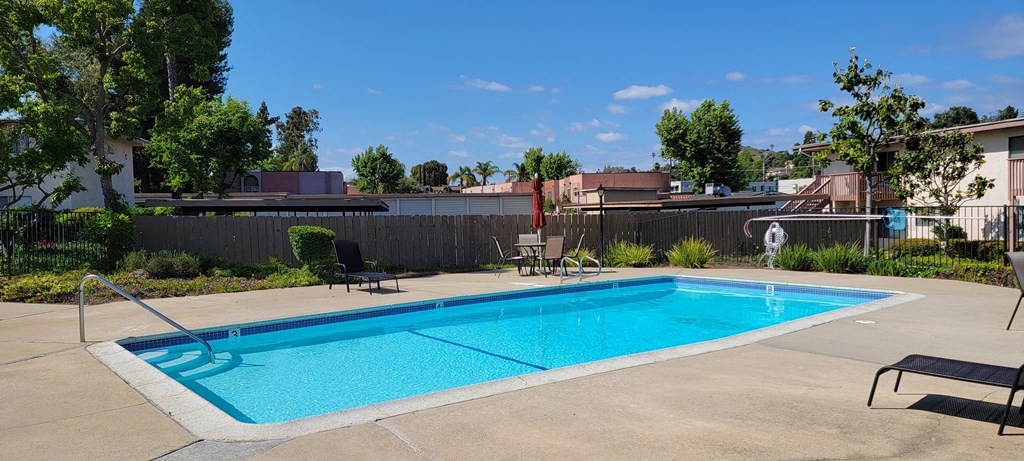 Invitiing pool and sun deck at Plaza Verde Apartments in Escondido, California.