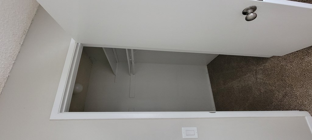 Large walk-in closet in carpeted bedroom at La Mesa Village Apartments in La Mesa, California.