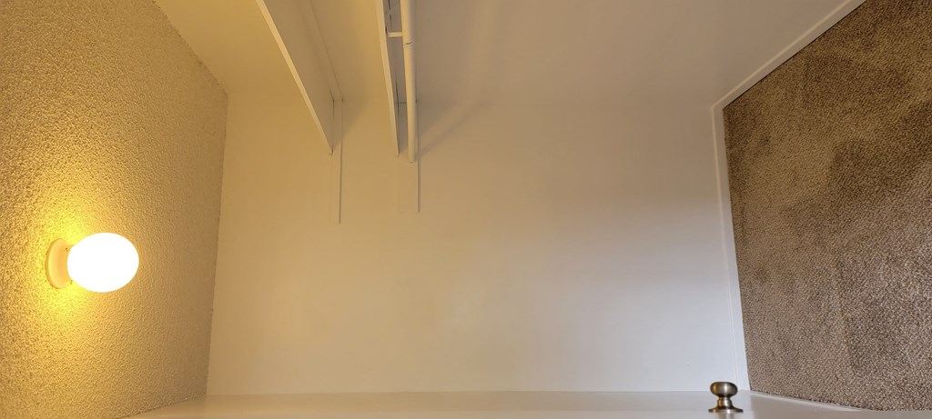 Walk-in closet in bedroom at La Mesa Village Apartments in La Mesa, California.