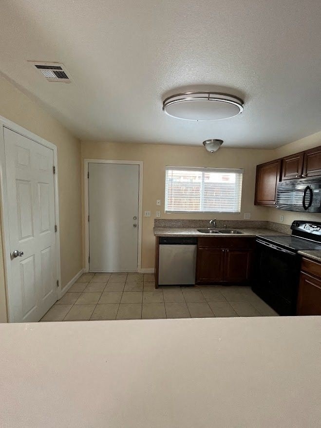 Kitchen with pantry at 980 E Mission Apartments in Escondido, CA.