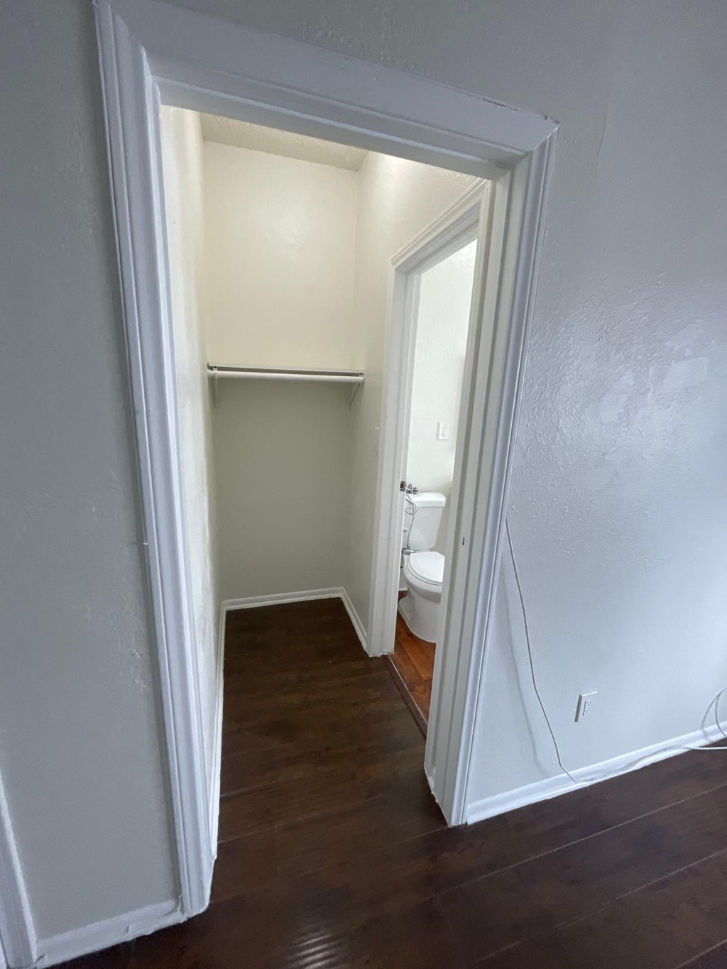 Hallway view of bathroom at Sanborn/Hoover Apartments in Los Angeles, CA.