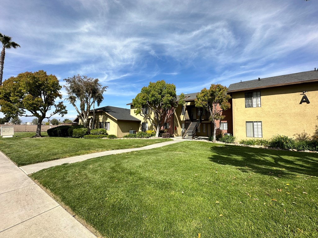 Nice lawns and gardens in front of Riverdale Apartment Homes in Hemet, California.