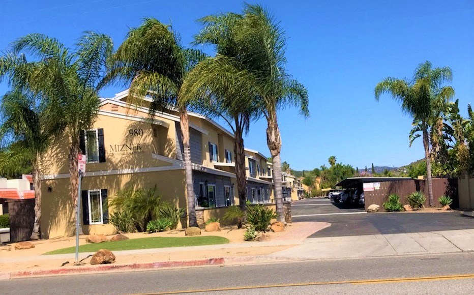 Apartment building and covered parking at 980 E Mission Avenue Apartments.