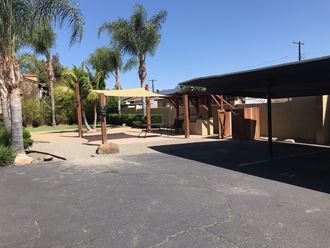 Picnic area with gas grills at 980 E Mission Avenue Apartments in Escondido, CA.