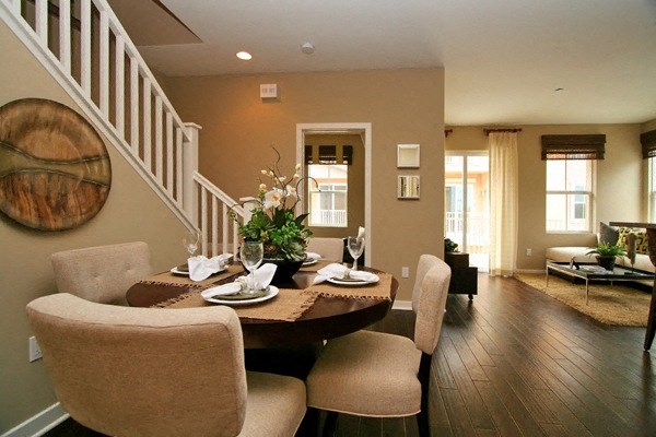 Dining room with hardwood flooring at Serenata Townhomes in San Diego, California.