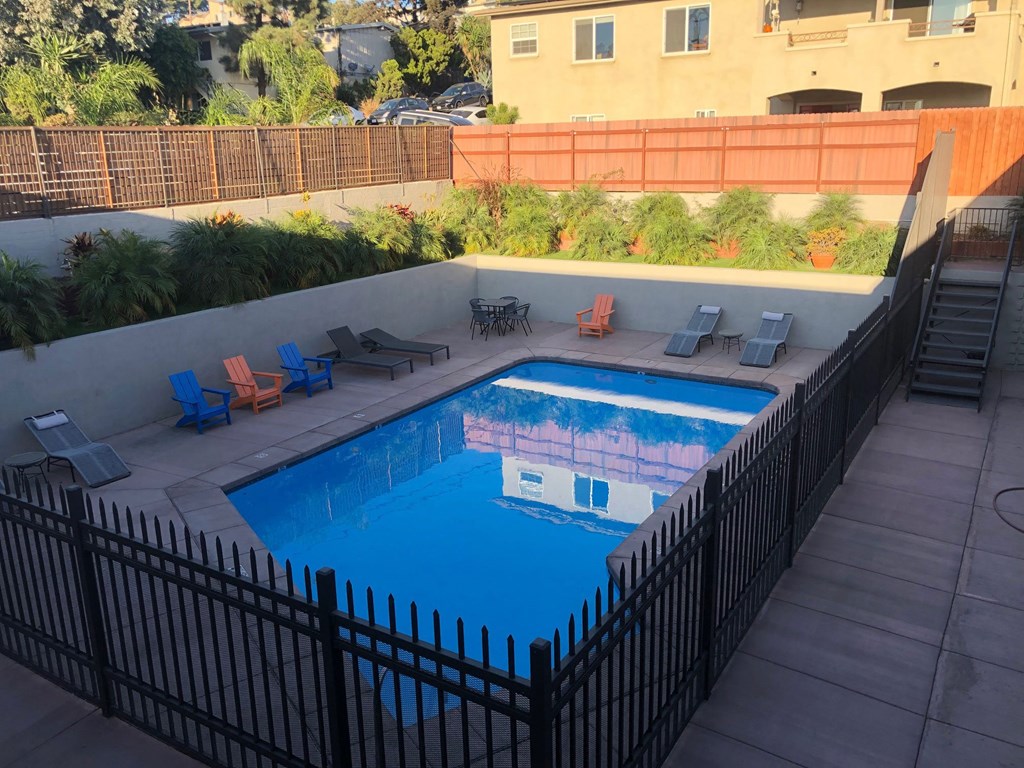 View of swimming pool and sundeck at 5747 Lauretta Street Apartments in San Diego, California.