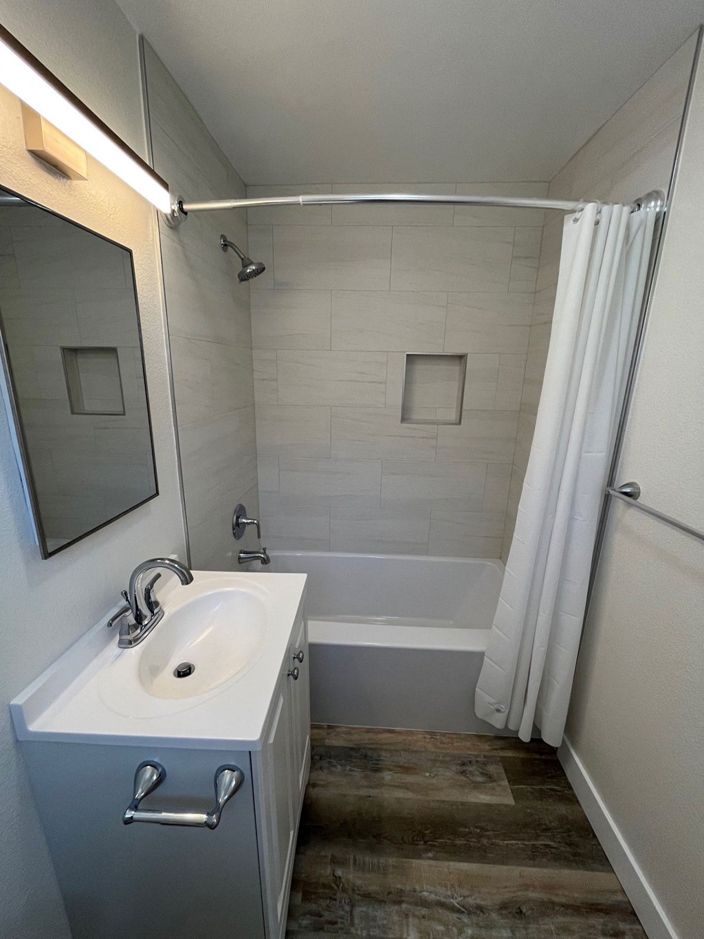 Bathroom with white fixtures at 5747 Lauretta Street Apartments in San Diego, California.
