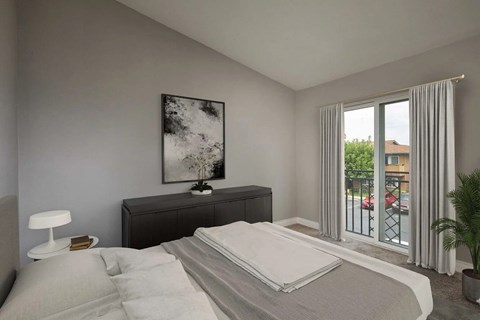 A bedroom with a large bed, a nightstand with a lamp, and a painting on the wall.