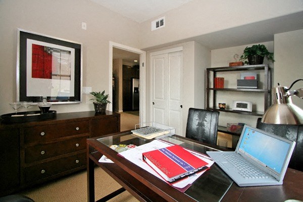 Large bedroom set up as home office at Serenata Townhomes in San Diego, California.