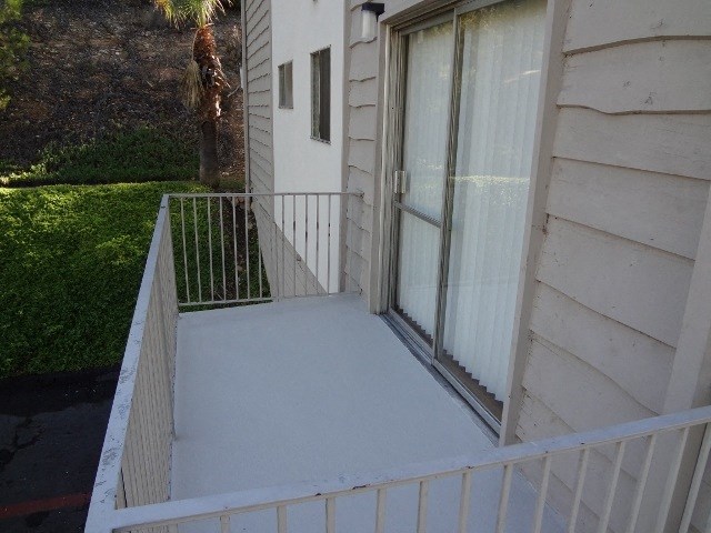 Balcony with nice landscaped view at Villa Knolls Apartments in La Mesa, California.
