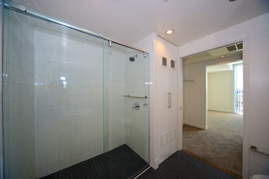 Master bedroom access to shower and closets at 12th Street Lofts in National City, California.