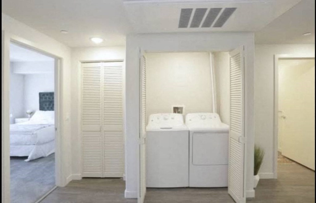 In-unit washer/dryer and closet space in apartment at City Plaza Apartments in Escondido, California.