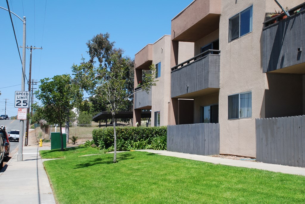 Lawns and gardens in front of Villa Pacific Apartments in Oceanside, California.