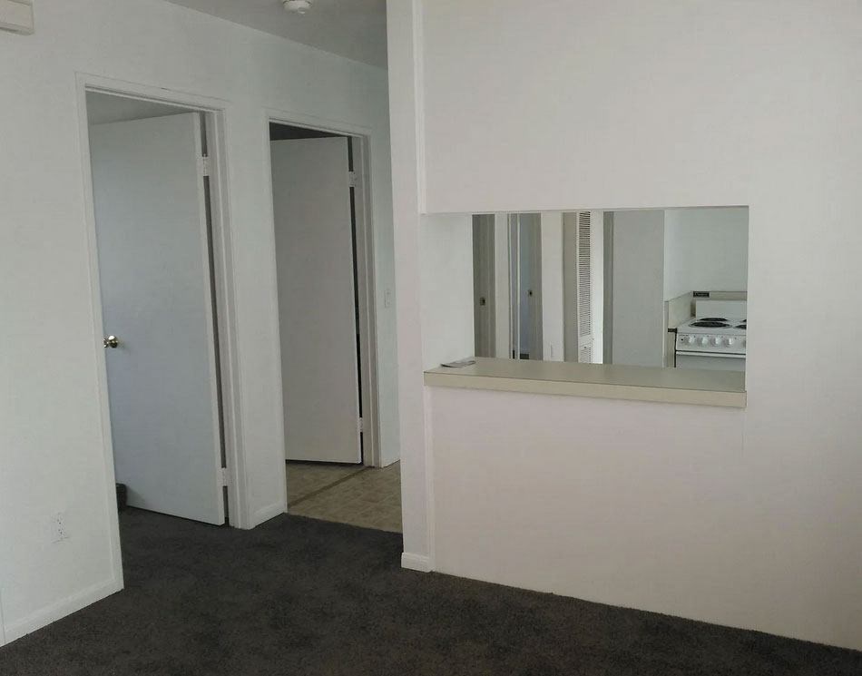 Front room looking towards open kitchen at Dubuque Apartments.