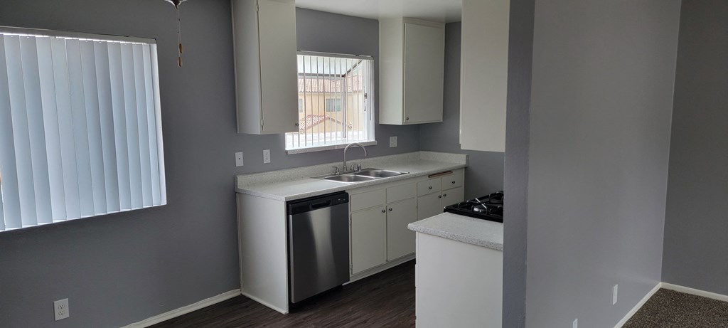 Kitchen and dining room area at Grand Oaks Apartments in Lake Elsinore, California.