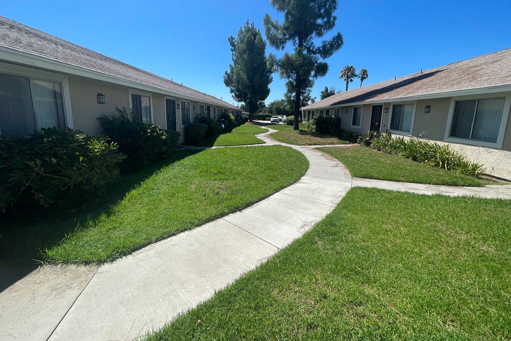 Serene courtyard between apartment units at Eucalyptus Apartments in Moreno Valley, California.