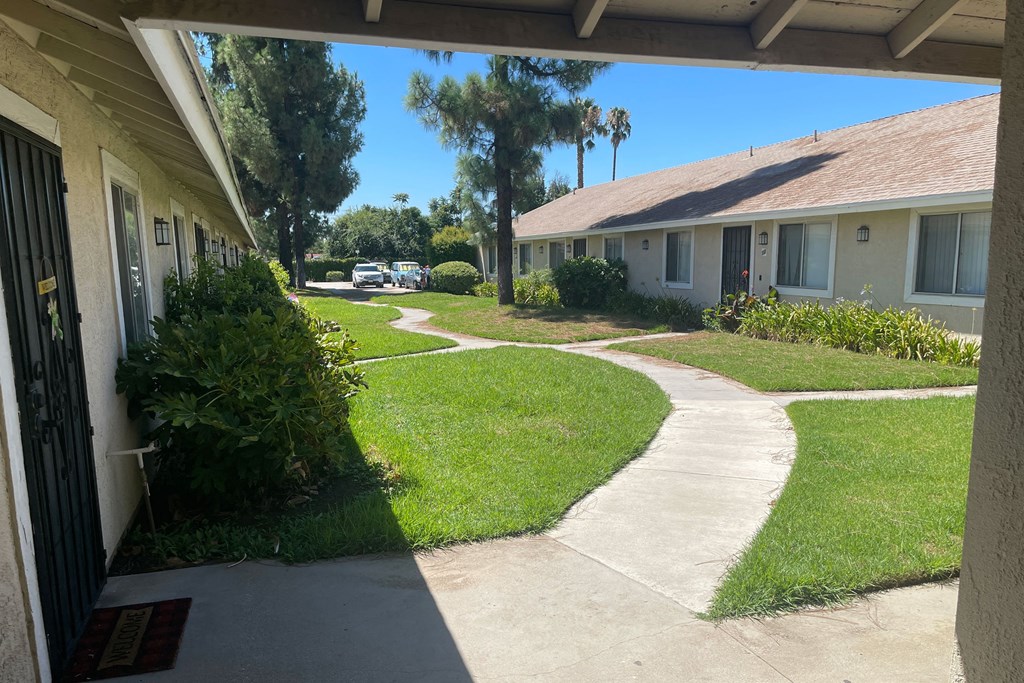 Looking out entrance hallway to back courtyard at Eucalyptus Apoartments in Moreno Valley, California.