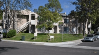 View from Gibralter street of La Costa 15 Apartments in La Coast, CA.