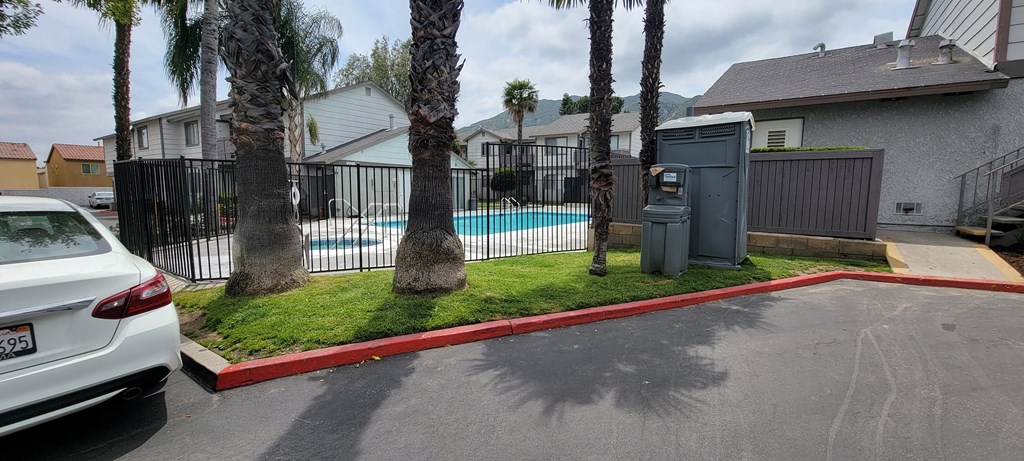 Palm trees around the swimming pool and spa at Grand Oaks Apartments in Lake Elsinore, California.