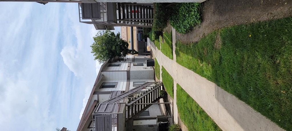 Walkway between buildings at Grand Oaks Apartments in Lake Elsinore, California.