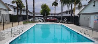 Clear and inviting swimming pool at Grand Oaks Apartments in Lake Elsinore, California.