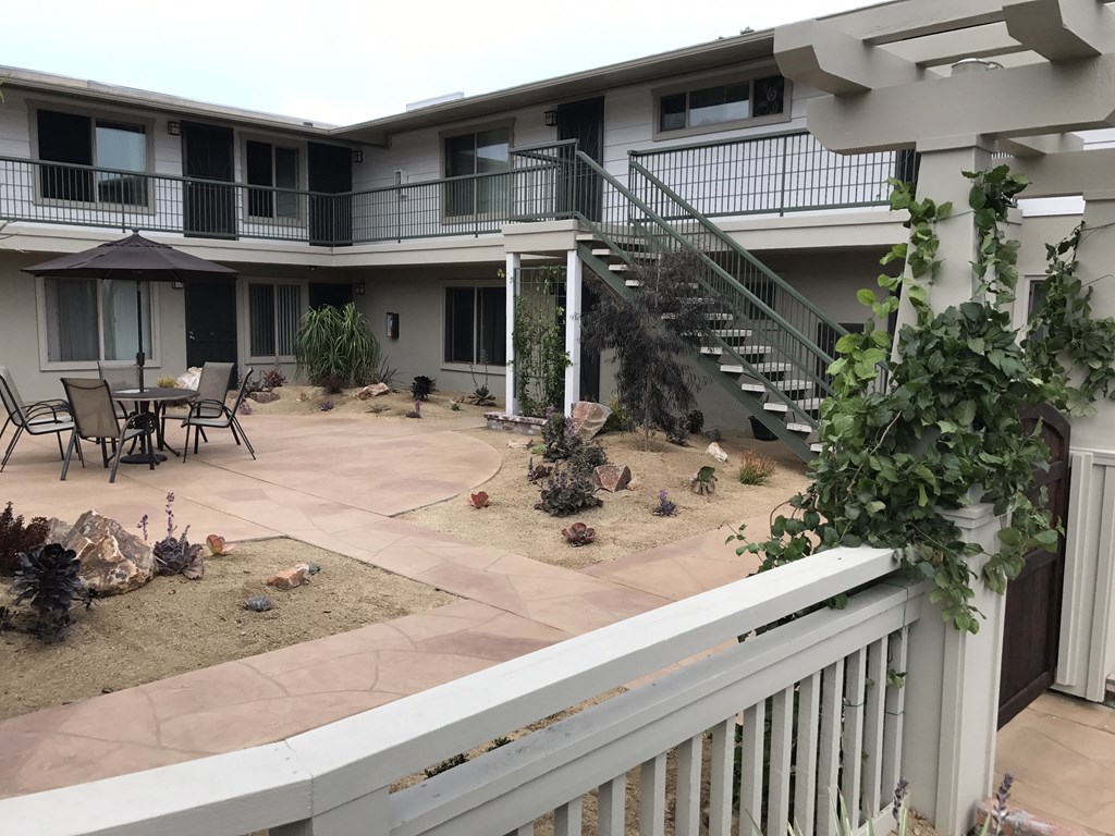 Serene desert garden motif in courtyard at Harbor Villa Apartments in San Diego, California.